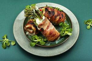 Meat wrapped asparagus photo