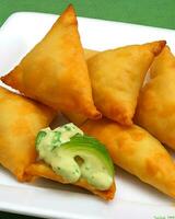 AI Generated Delicious Chicken Samosa with Green Chilli Sos and Dry Chilli Sos free photo