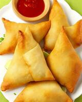 AI Generated Delicious Chicken Samosa with Green Chilli Sos and Dry Chilli Sos free photo