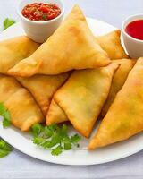 AI Generated Delicious Chicken Samosa with Green Chilli Sos and Dry Chilli Sos free photo