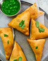 AI Generated Delicious Chicken Samosa with Green Chilli Sos and Dry Chilli Sos free photo