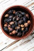 Pile of dried rose hips photo