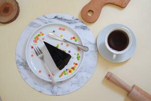 Piece of homemade chocolate crepes cake on a white plate photo