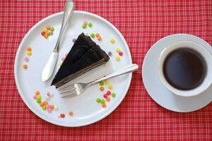 Piece of homemade chocolate crepes cake on a white plate photo