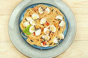 Pasta with fried clams. photo