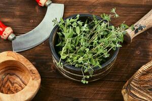 Fresh marjoram leaves on the table. photo