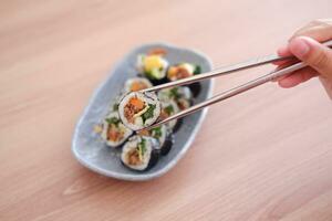 Sushi roll japanese food style on wooden table background. photo