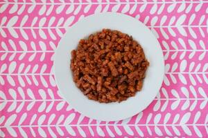 Orek tempe or Sauteed Tempeh is a typical Indonesian cuisine with herbs, garlic, onion, chilli and soy sauce. It tastes delicious photo