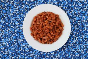 Orek tempe or Sauteed Tempeh is a typical Indonesian cuisine with herbs, garlic, onion, chilli and soy sauce. It tastes delicious photo