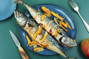 Baked mackerel with mango, seafood. photo