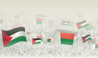 Palestine and Madagascar flags in a crowd of cheering people. vector