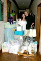 Amelia Heinle and Thad Luckinbill with thier shower gifts Amelia Heinle Luckinbill Baby Shower Home of Melody Thomas Scott Los Angeles CA October 8 2007 2007 photo