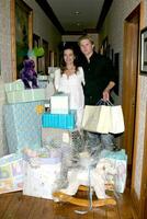 Amelia Heinle and Thad Luckinbill with thier shower gifts Amelia Heinle Luckinbill Baby Shower Home of Melody Thomas Scott Los Angeles CA October 8 2007 2007 photo