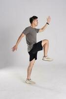 Image of Asian man exercising on white background photo