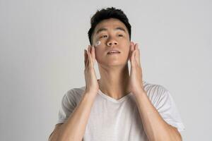 Portrait of Asian man posing on white background photo