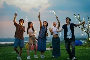 Image of group of friends celebrating and drinking beer together photo