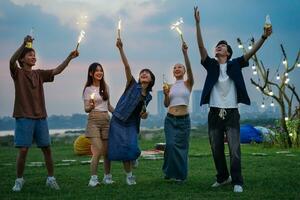 Image of group of friends celebrating and drinking beer together photo