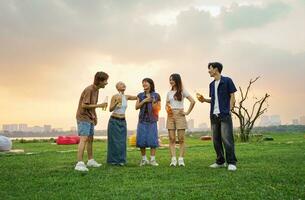 Image of group of friends celebrating and drinking beer together photo