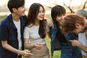 Image of a group of young Asian people laughing happily together photo