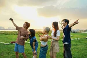 Image of a group of young Asian people laughing happily together photo