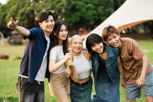 Image of a group of young Asian people laughing happily together photo