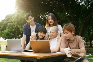 Image of a group of Asian students studying together photo