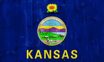 Flag of Kansas on a textured background. Concept collage. photo