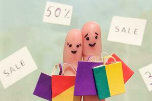 Finger art of a Happy couple with shopping bags photo