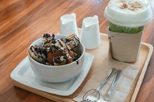 Banana chocolate chip bread slices with milk and ice honey tea photo