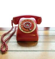 Red telephone vintage old style on table photo