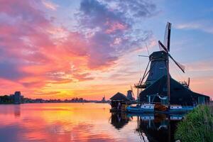 Windmills at Zaanse Schans in Holland on sunset. Zaandam, Nether photo