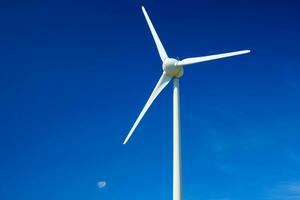 Wind generator turbines in sky photo