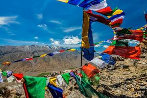 Buddhist prayer flags lungta in Spiti Valley, India photo