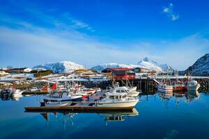 Fishing boats and yachts on pier in Norway photo