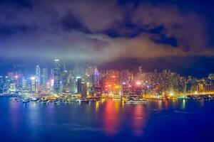 Aerial view of illuminated Hong Kong skyline. Hong Kong, China photo