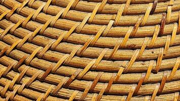 abstract texture of a wicker basket made of bamboo for background photo