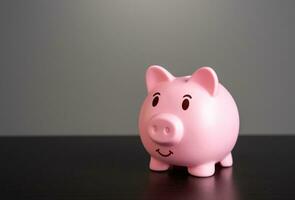 Smiling pig piggy bank. Savings and deposit banking. Healthy economy. photo