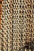 a close up of a chain link wall photo