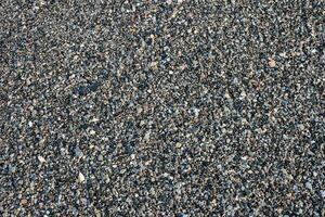 a black and white photo of gravel on the ground