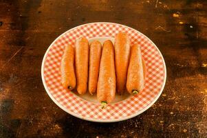 a plate with six carrots on it photo