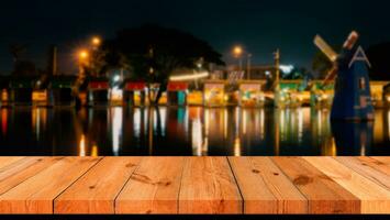 perspective wooden board over blurred view at night photo