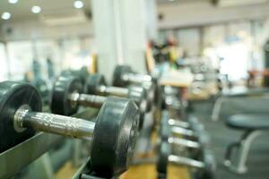 Closeup Rows of dumbbells in the gym photo