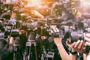 large number of press and media reporter in broadcasting event photo