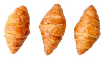 Top view of three separated fresh croissants in set isolated with clipping path in png file format. Set or collection of croissants