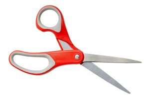 Single scissors with red handle isolated on white background with clipping path photo
