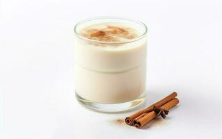 Old fashioned glass of homemade eggnog with cinnamon isolated on a white background. AI Generative photo