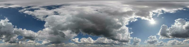 360 hdri panorama of blue overcast skydome with cumulus clouds, seamless sky panorama view with zenith for use in 3d graphics or game development or edit drone shot photo