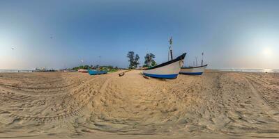 360 hdri panorama near old fishing boats in sand on ocean or sea at sunset in equirectangular spherical seamless projection photo