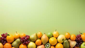 Fruits and berries arranged in a row on green background with copy space. AI Generated. photo