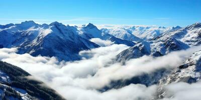 panoramic view of snowy mountains in the clouds on a sunny day. AI Generated. photo